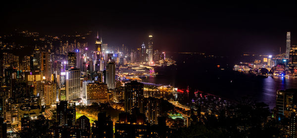 High angle view of illuminated buildings in city at night