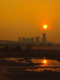 Scenic view of sunset over city