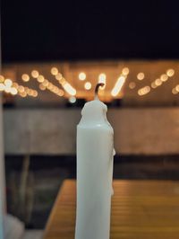 Close-up of candle on table