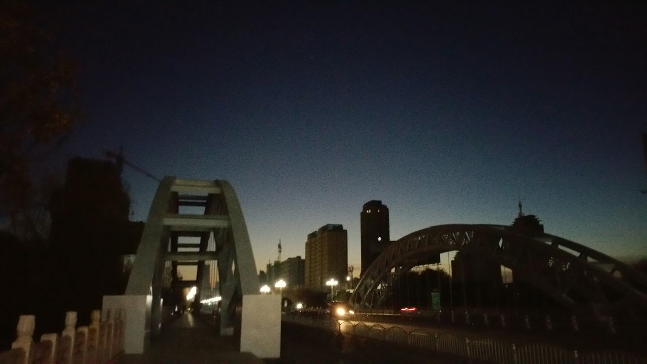 architecture, built structure, building exterior, night, illuminated, clear sky, copy space, city, bridge - man made structure, travel destinations, connection, sky, low angle view, famous place, dusk, arch, outdoors, capital cities, bridge, history