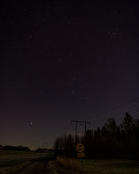 Scenic view of field against sky at night