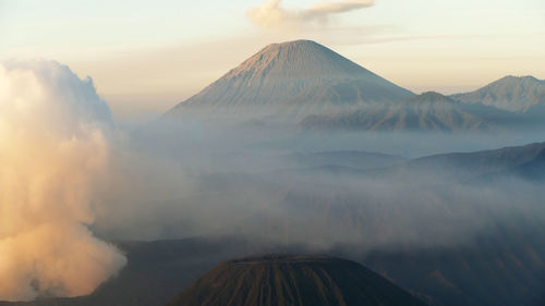 Panoramic view of volcanic landscape against sky during sunset