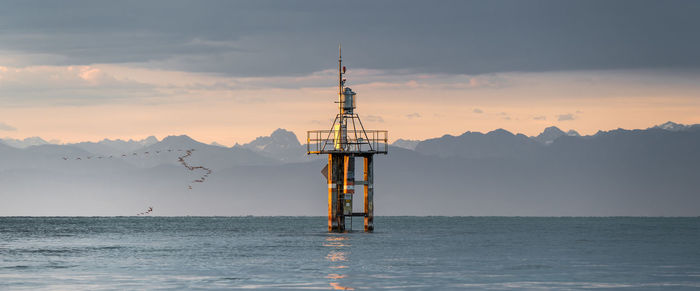 Scenic view of lake constance against sky during sunrise