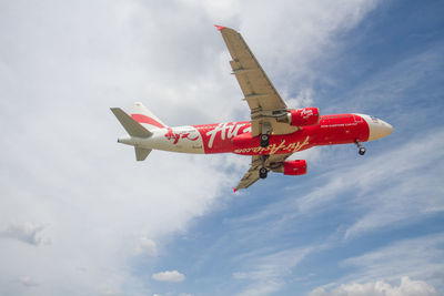 Low angle view of airplane flying in sky