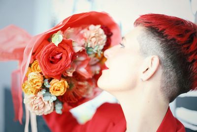 Close-up of woman holding rose bouquet