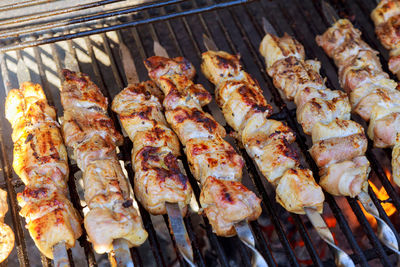 High angle view of meat on barbecue grill