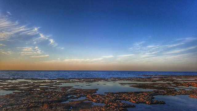 sea, horizon over water, water, beach, scenics, tranquil scene, sky, tranquility, beauty in nature, shore, nature, idyllic, blue, sunset, sand, cloud - sky, calm, coastline, cloud, remote