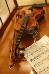 High angle view of wineglass with violin