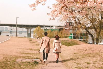 Rear view of couple walking outdoors