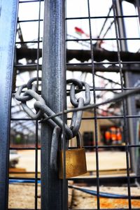 Close-up of chain on metal gate