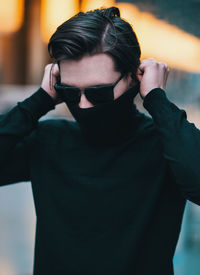 Portrait of young man wearing sunglasses