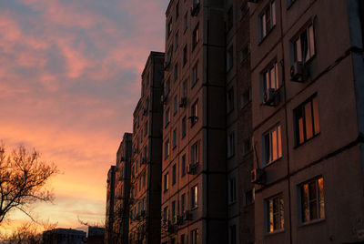 Low angle view of buildings at sunset