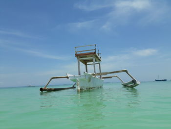 Ship in sea against sky