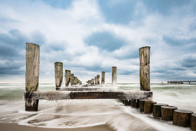 Bridge over sea against sky