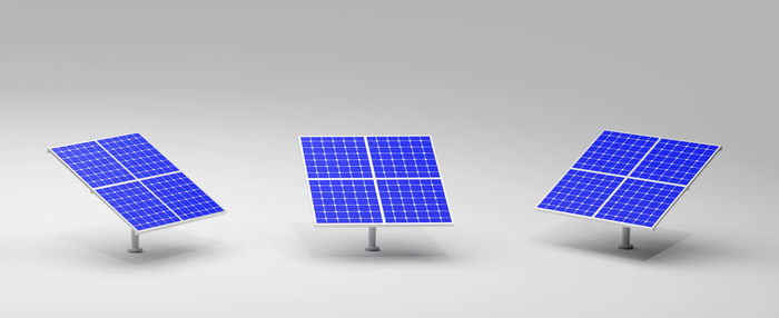 Low angle view of solar panel against white background