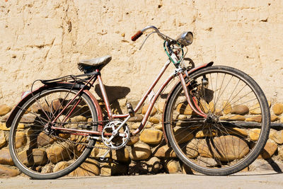 Bicycles parked against wall