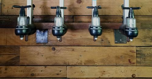 High angle view of bottles on wooden floor