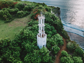 High angle view of cross on tree by sea