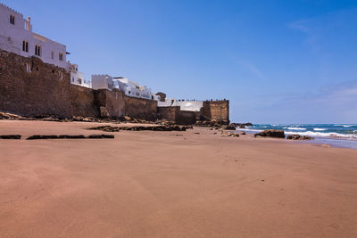 View of beach against blue sky