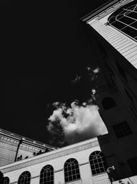 Low angle view of buildings against sky in city