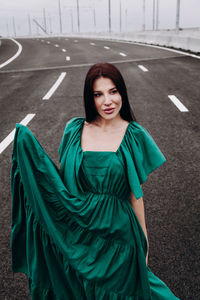 Portrait of a smiling young woman outdoors