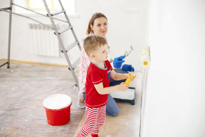 Portrait of siblings playing in bathroom