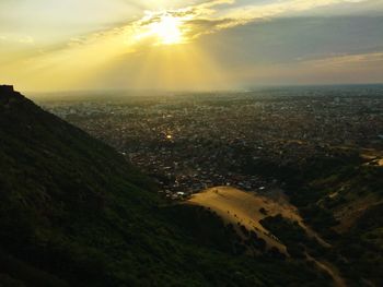 Aerial view of city during sunset