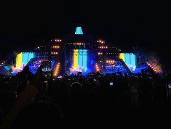 Crowd at music concert at night