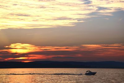 Scenic view of calm sea at sunset