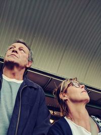 Portrait of young couple looking at camera