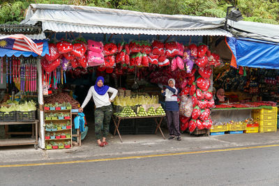 People at market stall in city