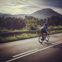 Person riding motorcycle on road