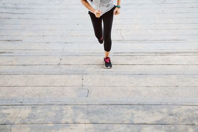 Low section of woman standing on floor