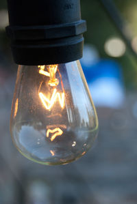 Close-up of illuminated light bulb