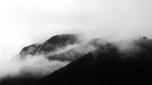 Scenic view of mountains in foggy weather