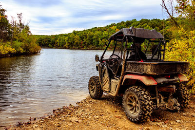 View of gazebo by lake against sky
