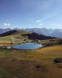 Scenic view of lake against blue sky