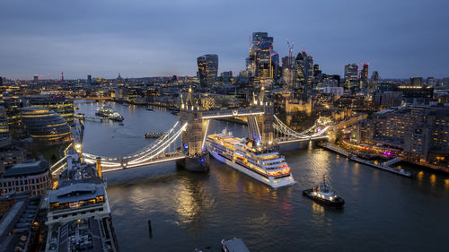 High angle view of illuminated bridge over river in city