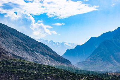 Scenic view of mountains against cloudy sky