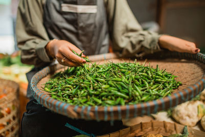 Midsection of man preparing food