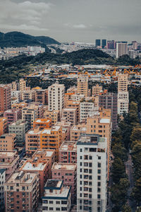 High angle view of buildings in city against sky