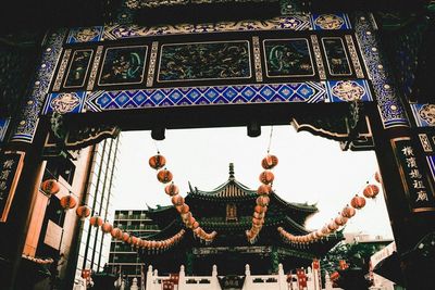 Low angle view of illuminated ferris wheel