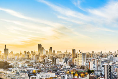 Cityscape against sky during sunset