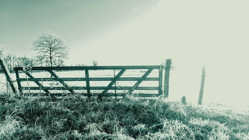 Snow covered field against sky