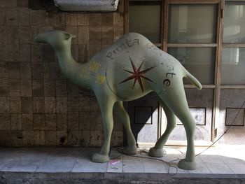 Close-up of sculpture against wall