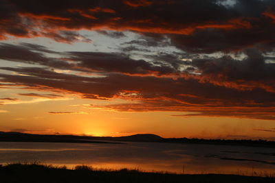 Scenic view of lake at sunset