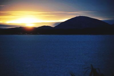 Scenic view of mountains at sunset