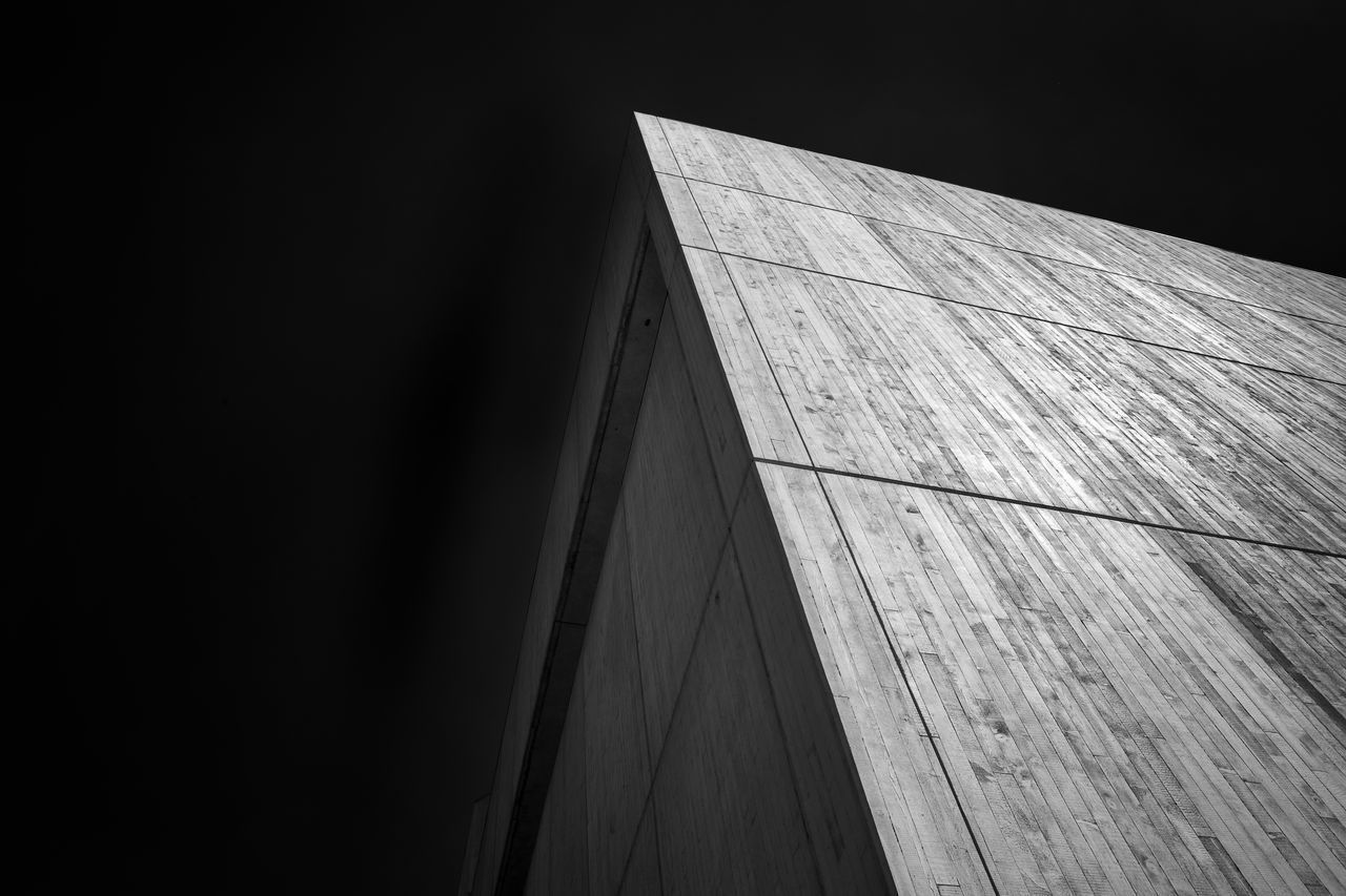 LOW ANGLE VIEW OF WALL AGAINST BUILDING