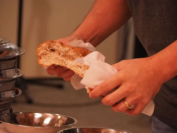 Midsection of man preparing food in kitchen