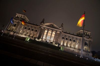 Low angle view of illuminated buildings at night